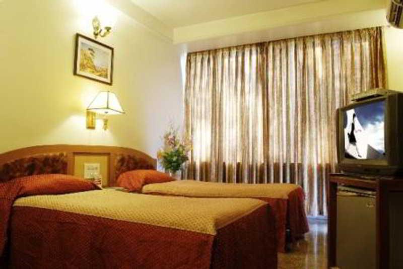 Hotel Mandakini Ambience Pune Phòng bức ảnh